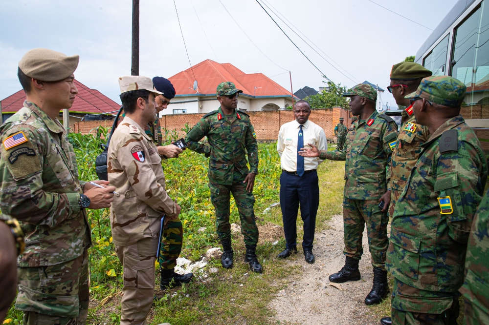 Brig Gen. Andrew Nyamvumba, the RDF 3rd Division Head of Operations, gestures as Brig Gen Patrick Karuretwa, the RDF Head of International Military Cooperation (centre), and the Defence Attachés look on, at Mbugangari, Rubavu, a few metres from the Rwanda-DR Congo border, on Monday, November 21. All photos/Courtesy.