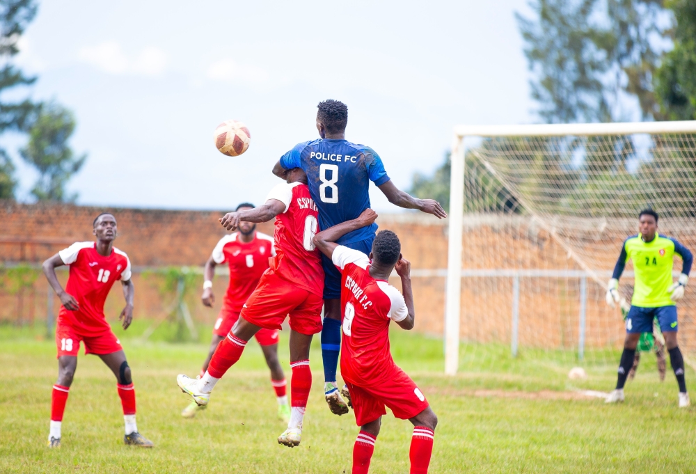 Police FC and Espoir FC players vie for the ball during the 1-0 match at Kamarampaka stadium in Rusizi District. Courtesy
