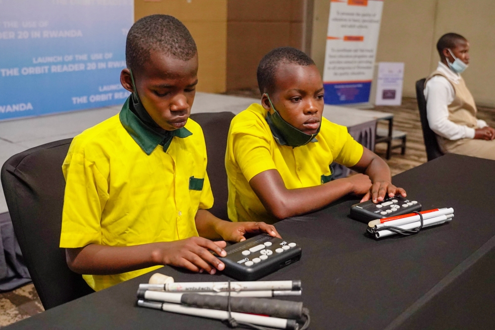 Some children with disabilities during the launch of the use of the Orbit Reader 20 on April 4, 2022. Activists have called upon the government to train more teachers for children with disabilities .Dan Nsengiyumva