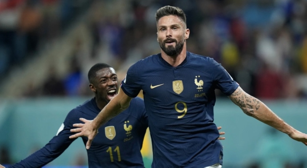 Olivier Giroud netted twice to become France&#039;s joint all-time top goal-scorer [Francisco Seco/AP]