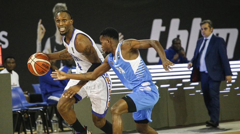 Rwandan star point guard Adonis Filer   who recently joined Urunani Basketball Club from Burundi, seen here trying to go past Kenya Ports Authority&#039;s point guard during the 72-43 victory game  in Group A&#039;s opening game. Courtesy