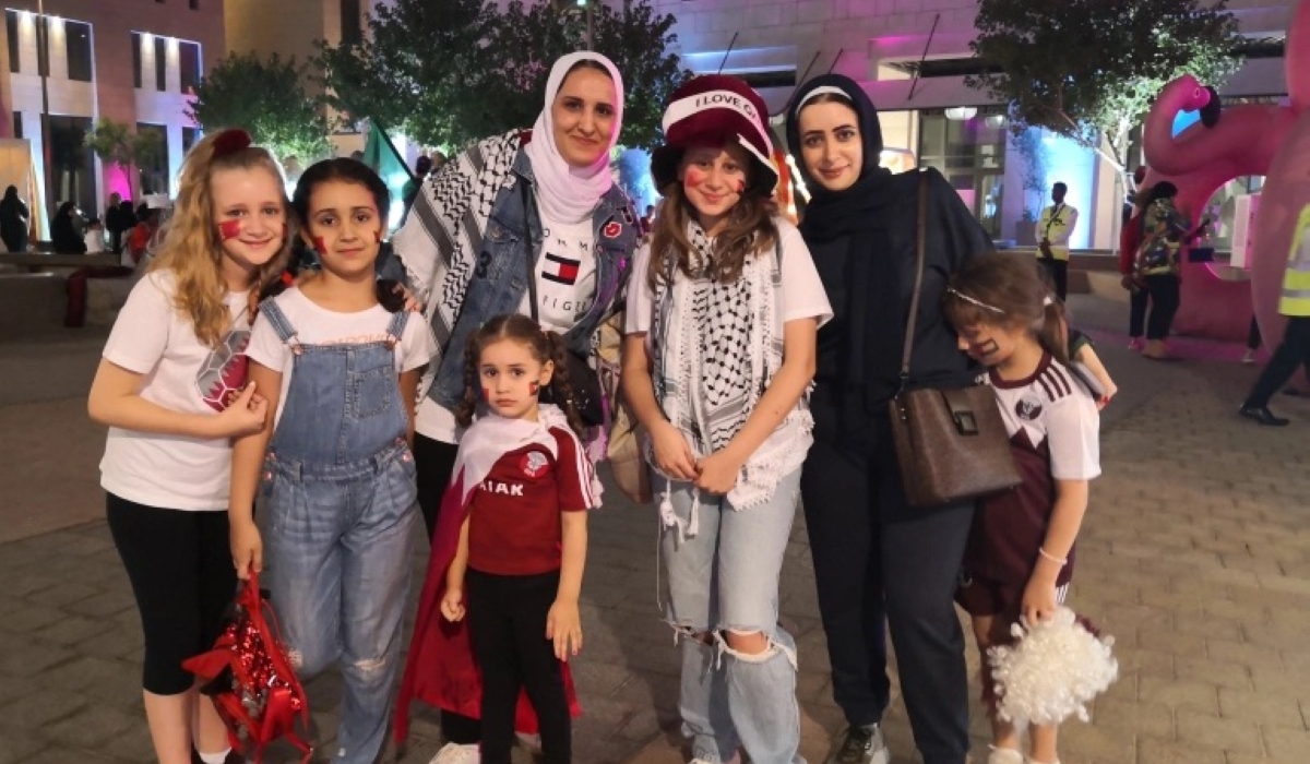 Sonia Nemmas, a Jordanian mother, third from left, with her three daughters and friends out in Doha supporting Qatar on Friday, November 18, 2022. [Hafsa Adil/Al Jazeera]