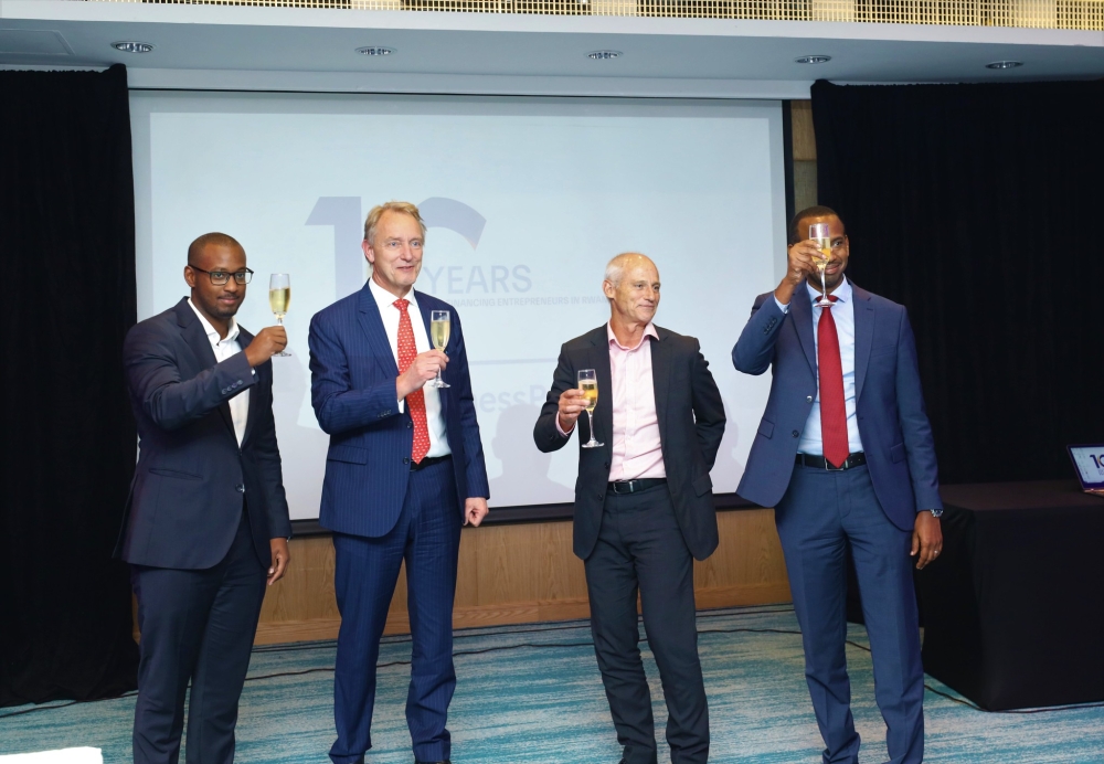 Chairman of BPI Africa Thos Gieskes(2nd Right) toasts with  other officials during the cerebration of 10 years anniversary on Tuesday, November 22. All Photos by Craish Bahizi