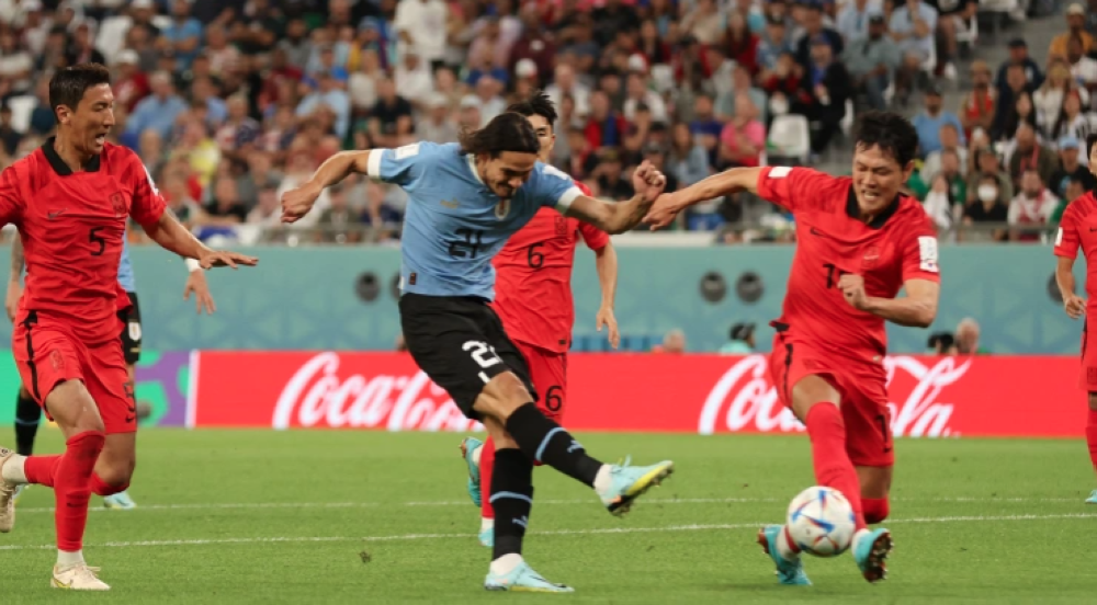 Uruguay&#039;s Edinson Cavani shoots at goal [Matthew Childs/Reuters