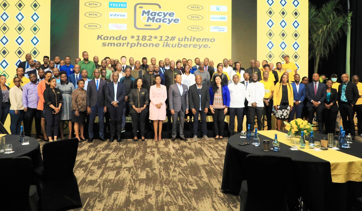 Delegates in a group photo during the launch of  a Device Financing Program dubbed ‘Macye Macye’ to enable customers to purchase smartphones and tablets by paying in installments.