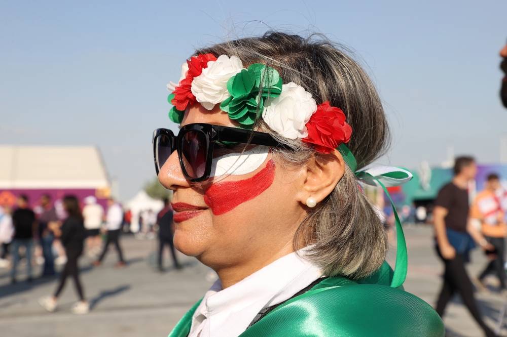 An Iranian fan arrives at Khalifa International Stadium ahead of the match between England and Iran. [Showkat Shafi/Al Jazeera]