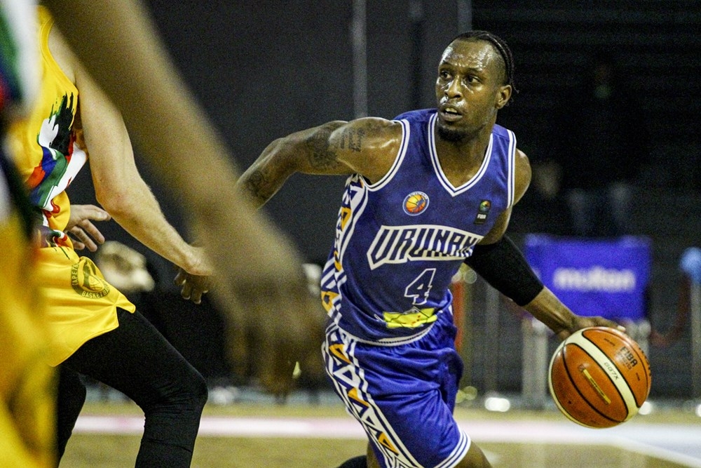 Adonis Filer tries to go past Tigers&#039; players as he drops 27 as Burundi&#039;s Urunani stuns Tigers. The Burundians beat hosts Cape Town Tigers 59-49 to finish top of the group and will head to the Semi-Finals high on confidence. Courtesy
