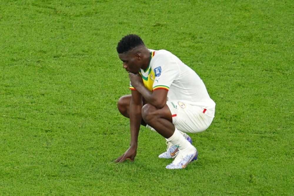 Senegal&#039;s Ismaila Sarr looks dejected after the loss to Netherlands at Al Thumama Stadium on November 21, 2022 [Molly Darlington/Reuters]