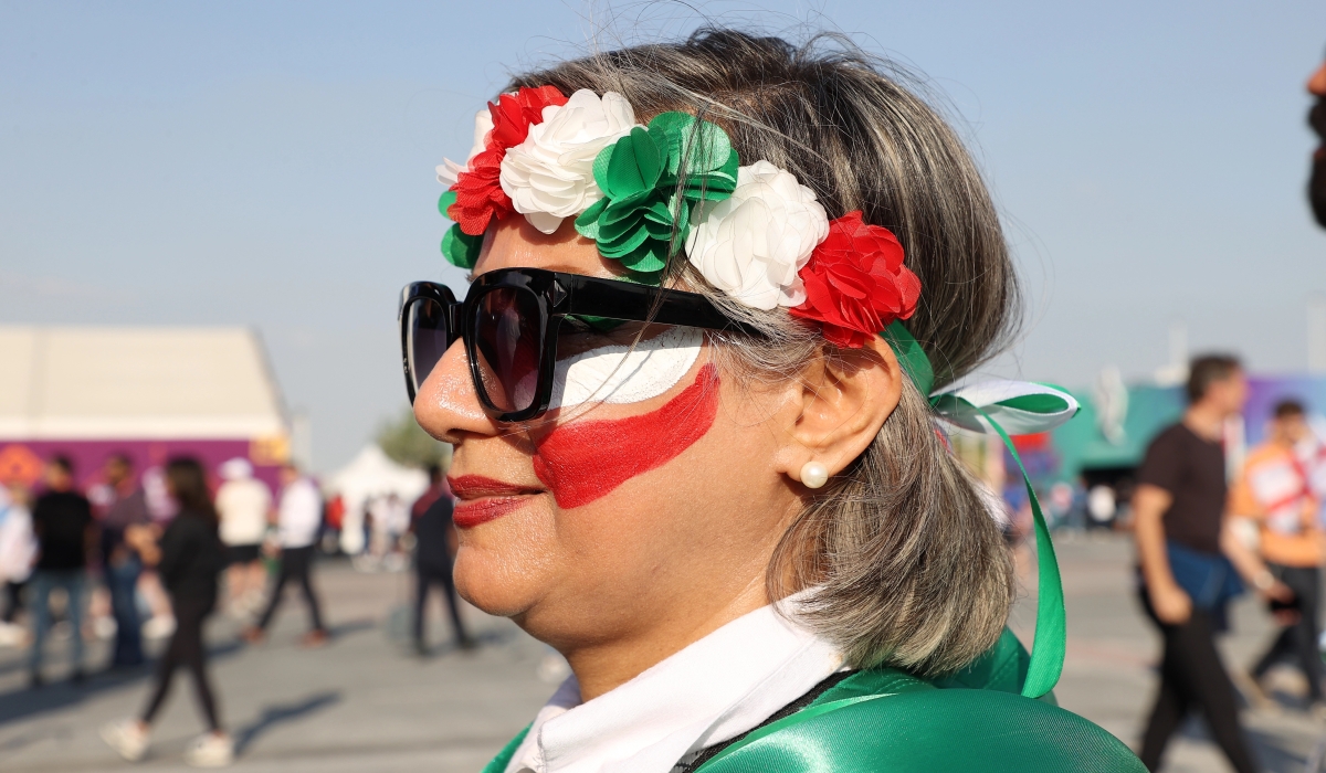 An Iranian fan arrives at Khalifa International Stadium ahead of the match between England and Iran. [Showkat Shafi/Al Jazeera]