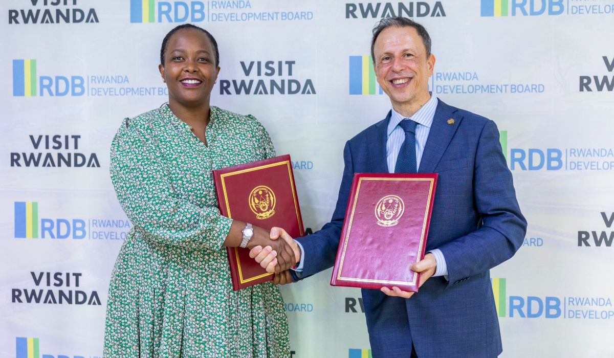 Rwanda Development Board CEO Clare Akamanzi and Luigi Ciarrocchi, CCUS, Forestry and Agri-Feedstock Director at Eni  after signing the agreement in Kigali on November 24. Courtesy