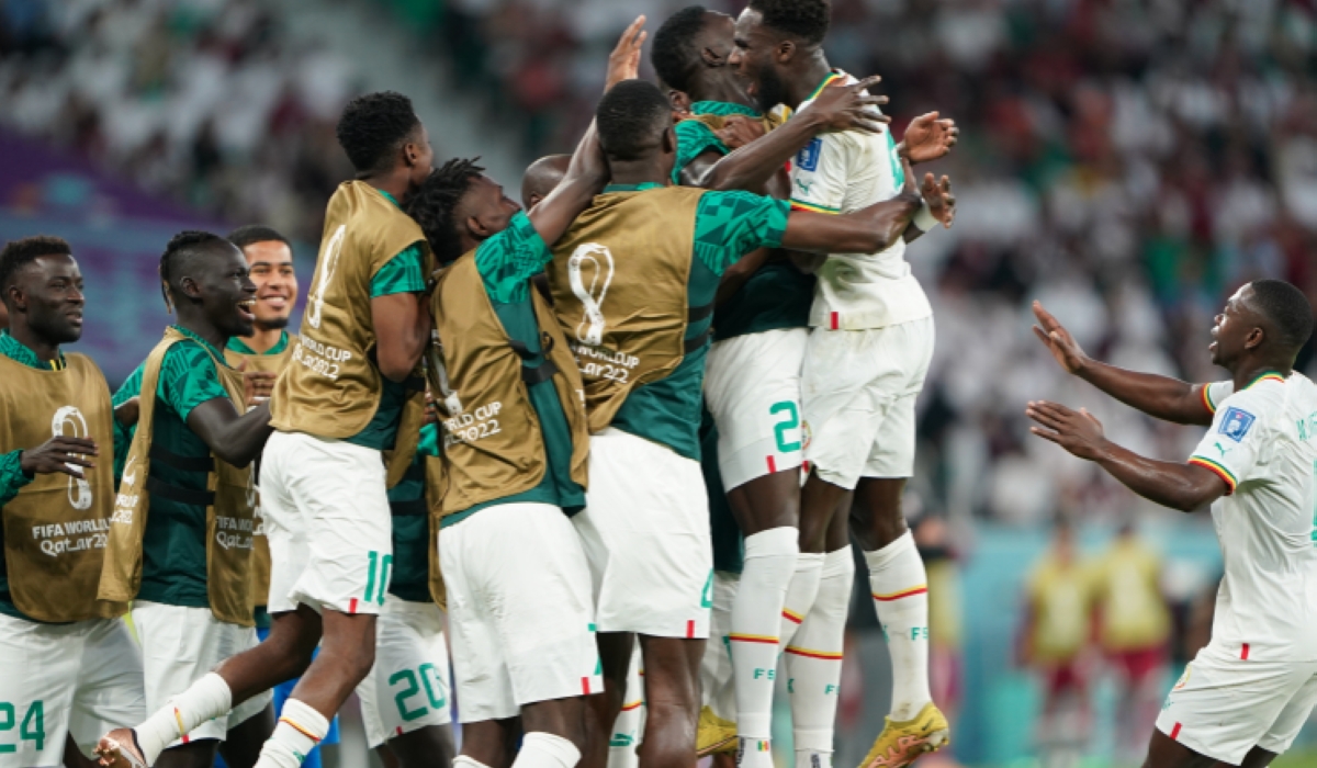Senegal team celebrate after scoring their second [Sorin Furcoi/Al Jazeera]