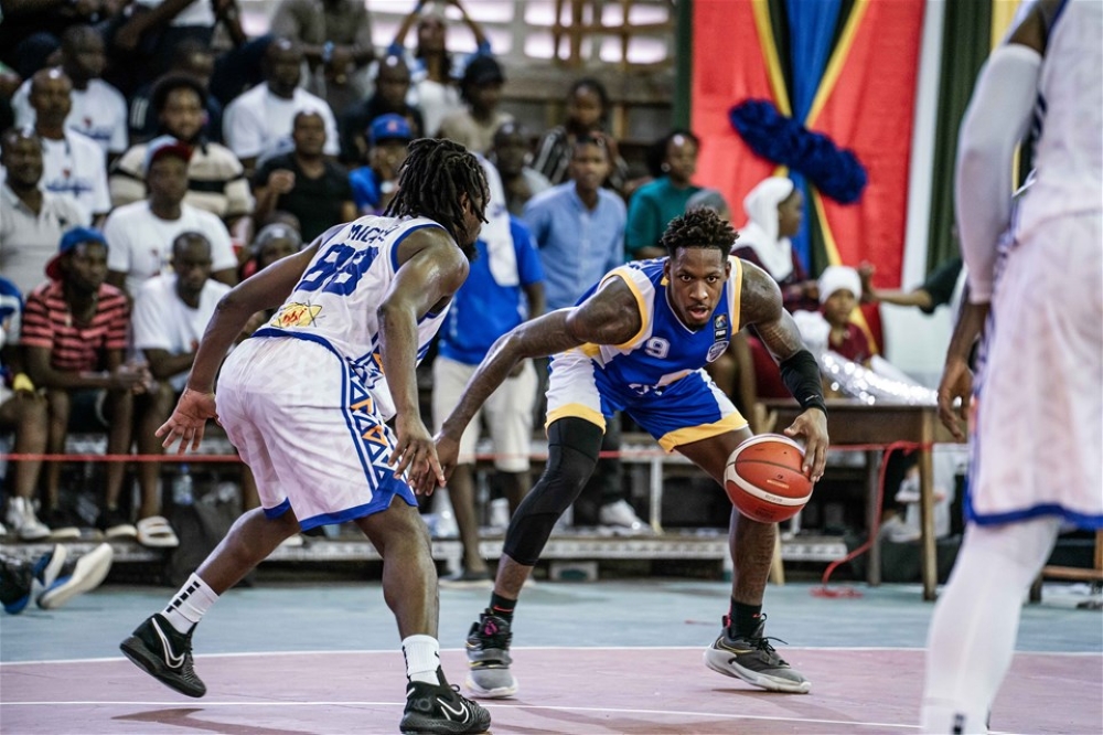 City Oilers player with the ball tries to go past Urunani&#039;s point guard during the game  last month in Dar es Salaam as  Urunani prevailed 64-58. Courtesy