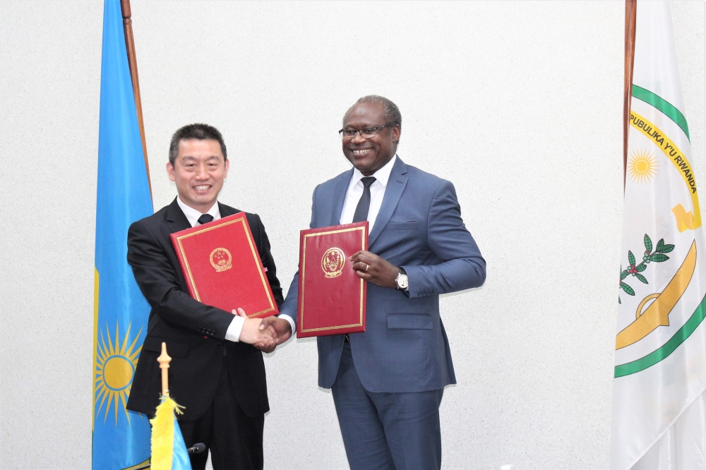  Minister of Finance, Uzziel Ndagijimana and the Chinese Ambassador to Rwanda Wang Xuekun after signing the agreement in Kigali on Monday, November 28. Courtesy