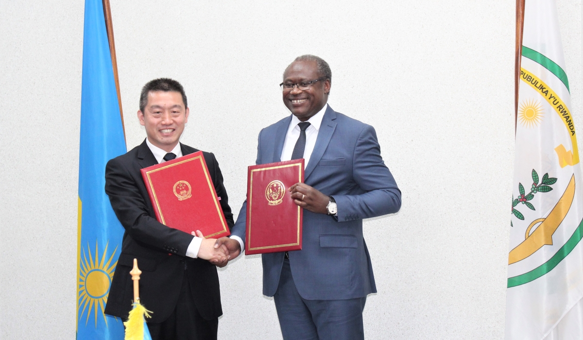  Minister of Finance, Uzziel Ndagijimana and the Chinese Ambassador to Rwanda Wang Xuekun after signing the agreement in Kigali on Monday, November 28. Courtesy