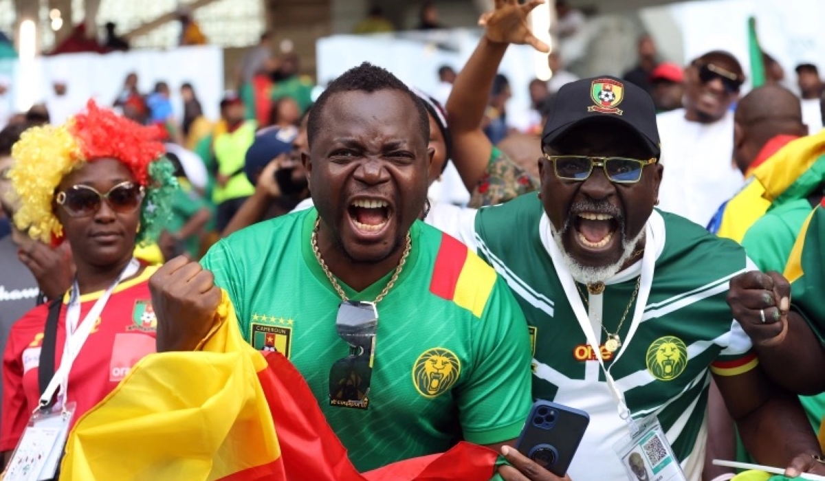 Cameroon fans celebrate their team’s equaliser [Showkat Shafi/Al Jazeera]