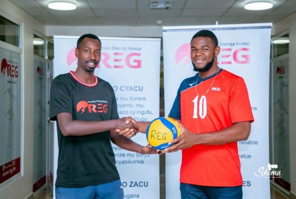 Rwanda Energy Group Volleyball Club head coach, Pierre Marshal Kwizera (L)  and Guebela Boyomo Auguste Marecha  the Cameroonian after signing ceremony on Tuesday, November 20. Courtesy