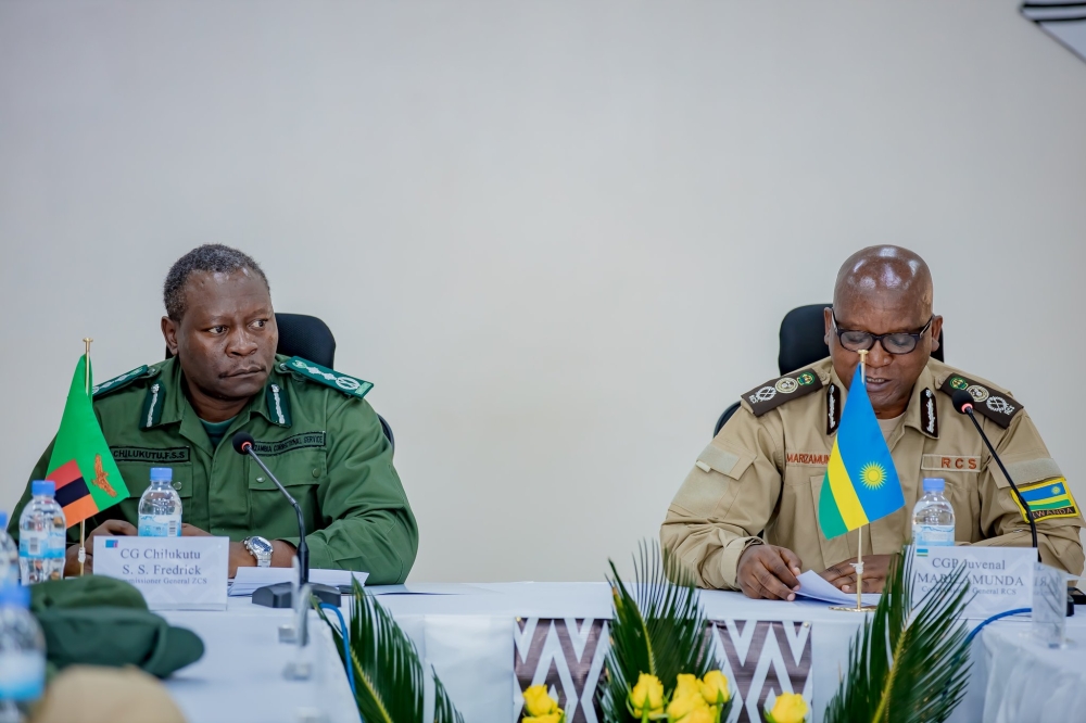 Juvenal Marizamunda, Rwanda  Correctional Services  Commissioner General, and his Zambia counterpart  Frederick Chilukutu during a meeting in Kigali on November 28. Courtesy