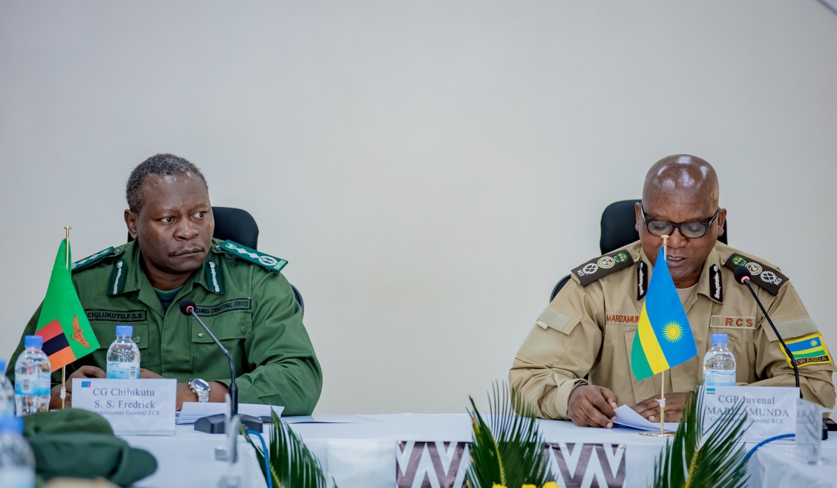 Juvenal Marizamunda, Rwanda  Correctional Services  Commissioner General, and his Zambia counterpart  Frederick Chilukutu during a meeting in Kigali on November 28. Courtesy