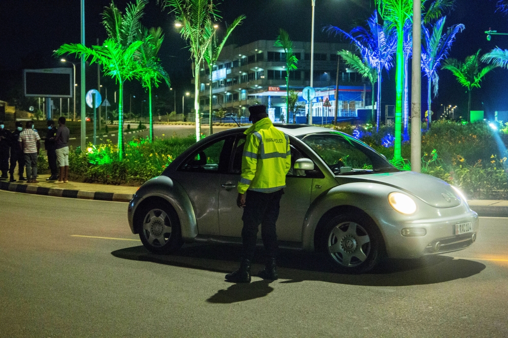 Traffic police officer inspects drivers at Sonatube roundabout in Kigali. Photo by Craish Bahizi