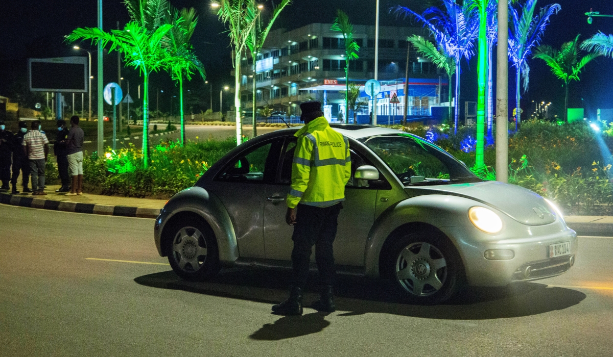 Traffic police officer inspects drivers at Sonatube roundabout in Kigali. Photo by Craish Bahizi