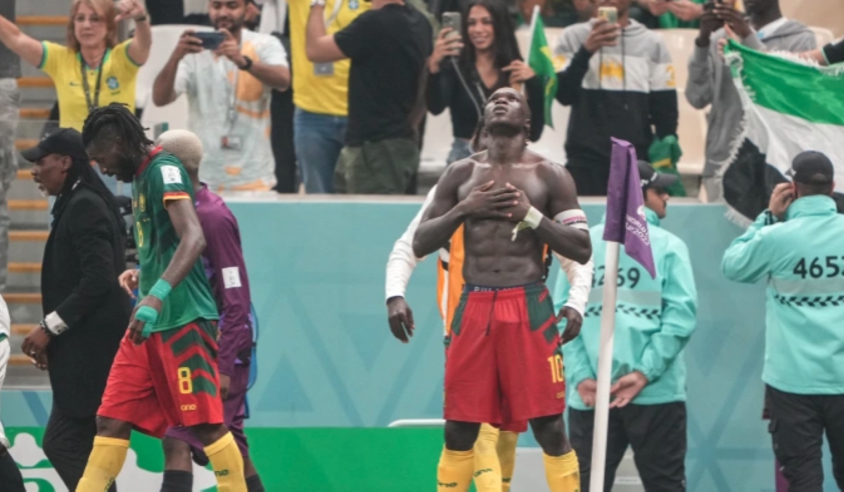A shirtless Vincent Aboubakar celebrates scoring Cameroon&#039;s goal [Sorin Furcoi/Al Jazeera]