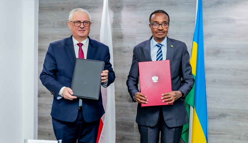 Minister of Defence Maj Gen Albert Murasira and Poland&#039;s Grzegorz Piechowiak  Deputy Minister  of Economic Development & Technology after signing the agreement in Kigali, on Monday, December 5. Courtesy