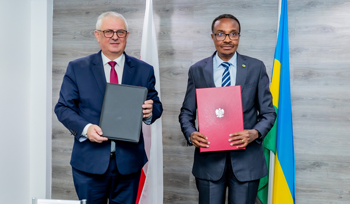 Minister of Defence Maj Gen Albert Murasira and Poland&#039;s Grzegorz Piechowiak  Deputy Minister  of Economic Development & Technology after signing the agreement in Kigali, on Monday, December 5. Courtesy