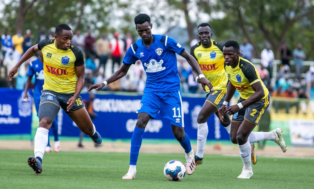 Gorilla FC player wins the ball against Rayon Sports players at Kigali Stadium last season. The Blues want to beat Gorilla to lead the league table. Olivier Mugwiza