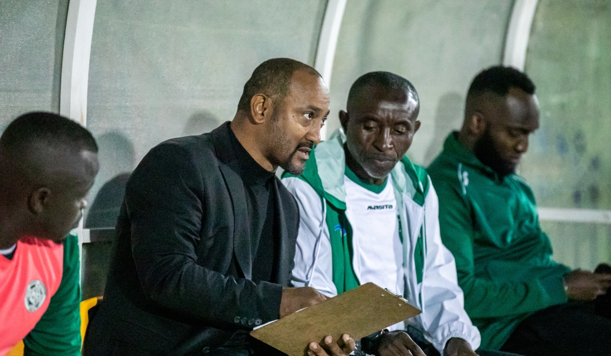 SC Kiyovu Head Coach Alain-Andre Landeut consult with assistant during the match agaisnt Rayon Sports. Kiyovu has renewed his contract to remain the head coach. Olivier Mugwiza