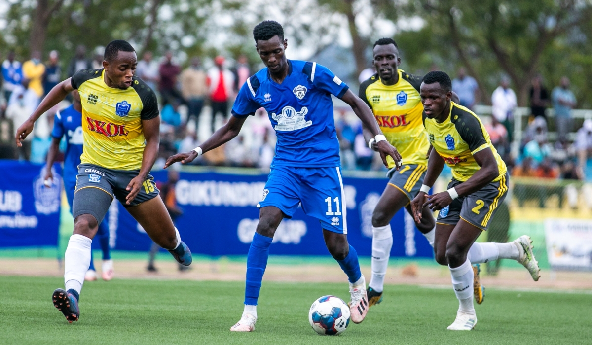 Gorilla FC player wins the ball against Rayon Sports players at Kigali Stadium last season. The Blues want to beat Gorilla to lead the league table. Olivier Mugwiza