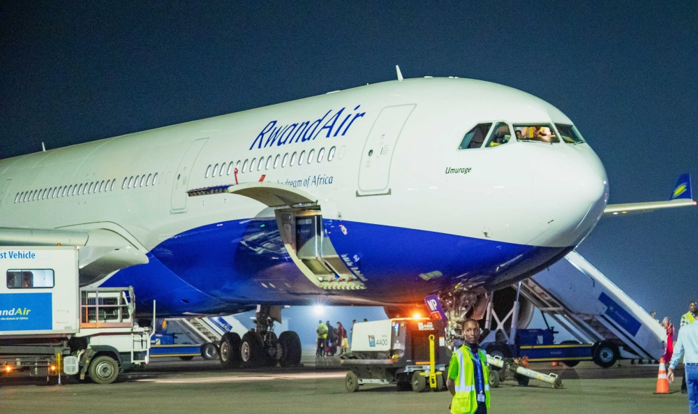 A RwandAir plane at Kigali International Airport. The national carrier has apologised for flight cancellations experienced in recent days. File.