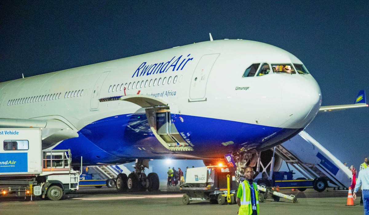 A RwandAir plane at Kigali International Airport. The national carrier has apologised for flight cancellations experienced in recent days. File.