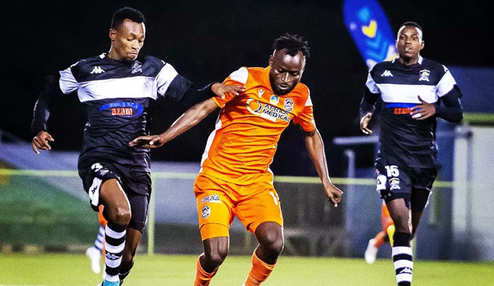 AS Kigali striker Shaban Hussein Shabalala wins the ball against APR FC defenders during a goalless draw at Kigali Stadium on December 8. Courtesy