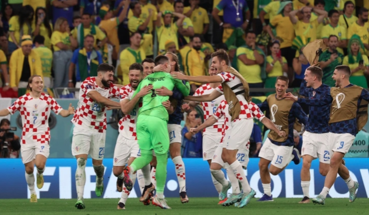 Croatia&#039;s players celebrate their win after beating Brazil in a penalty shoot-out at the Education City Stadium [Showkat Shafi/Al Jazeera]
