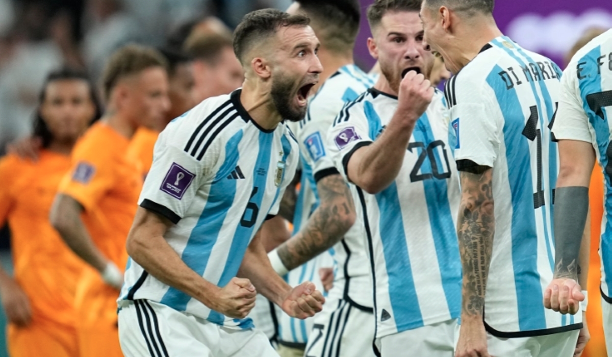 Argentina players celebrate during the penalty shootout in the World Cup quarterfinal soccer match between the Netherlands and Argentina [Ebrahim Noroozi/AP Photo]