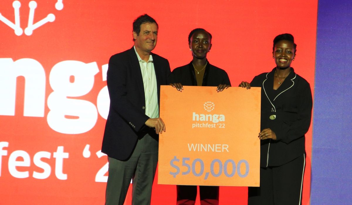 Minister of ICT and Innovation Paula Ingabire (Right) and RDB Chairman Itzhak Fisher.(Left ) awarding Young innovator Peace Ndoli (C), the founder of Lifesten health after becoming  the overall winner of this year’s Hanga Pitchfest on Saturday, December 10. All Photos by Craish Bahizi