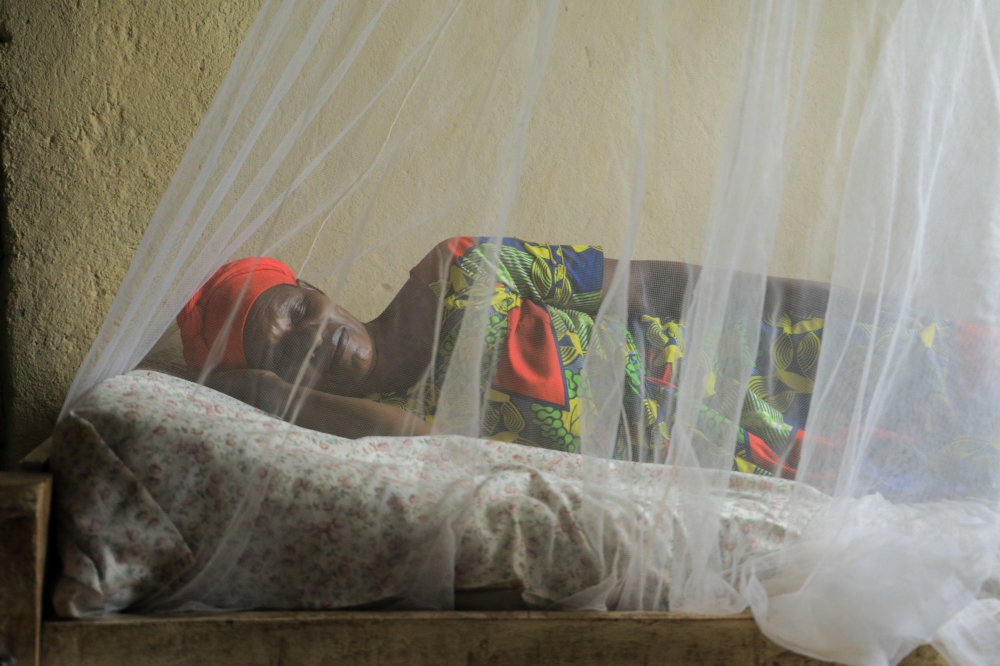 A  woman sleeps under a mosquito net in Bugesera. Rwanda is hosting the 2nd International Conference on Public Health in Africa (CPHIA), where experts and stakeholders will discuss improving health care on the continent.