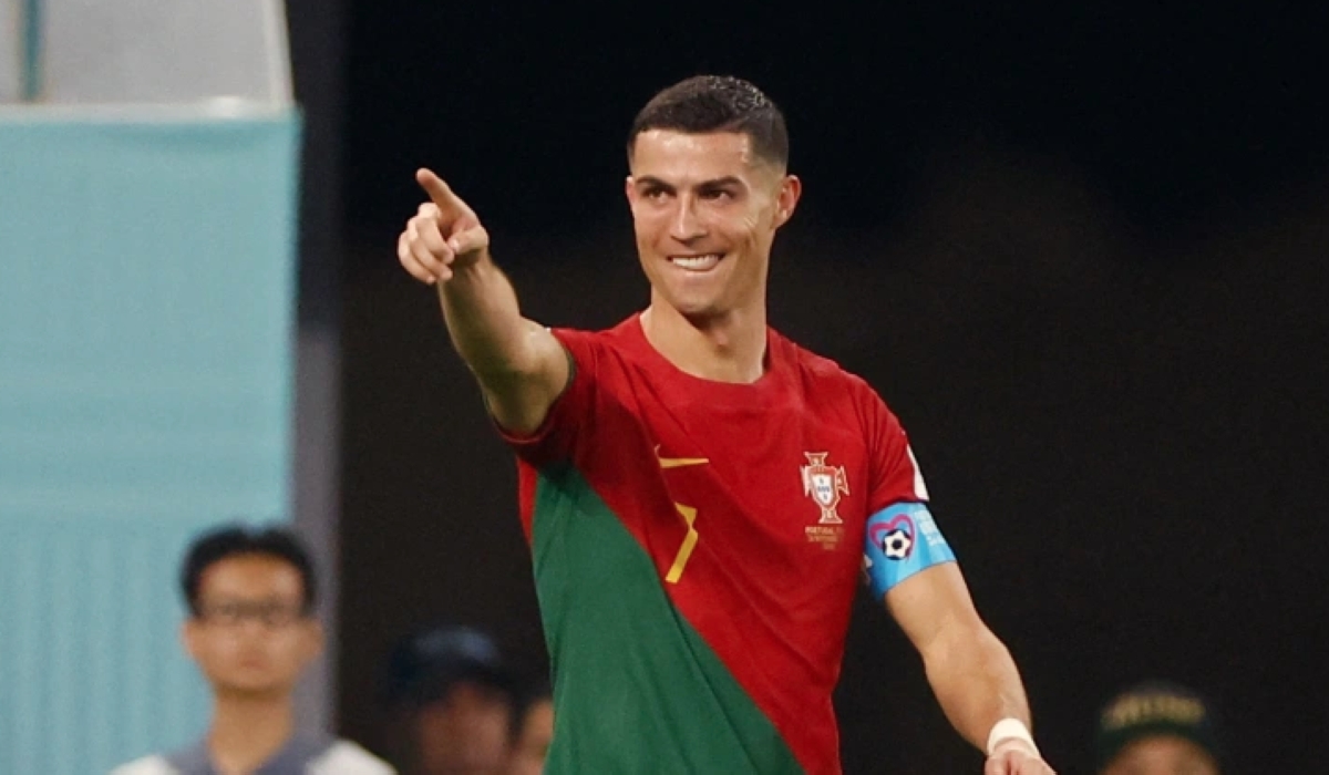 Portugal’s Cristiano Ronaldo celebrates after scoring against Ghana at the 2022 FIFA World Cup on November 24, making him the only player in history to have scored in five World Cups [Reuters/Hannah Mckay]