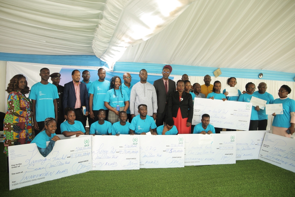 Winners and officials pose for a group photo as NIRDA has incubated and awarded eight business projects of young innovators that are adding value to cow products and cow by-products. Photo by Craish BAHIZI