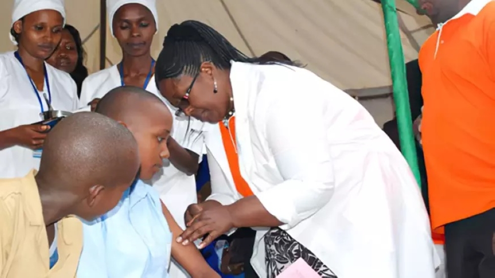 Health workers conduct a cervical cancer vaccination exercise in Nyanza.  Rwanda was committed to eliminating cervical cancer in a short period of time. File