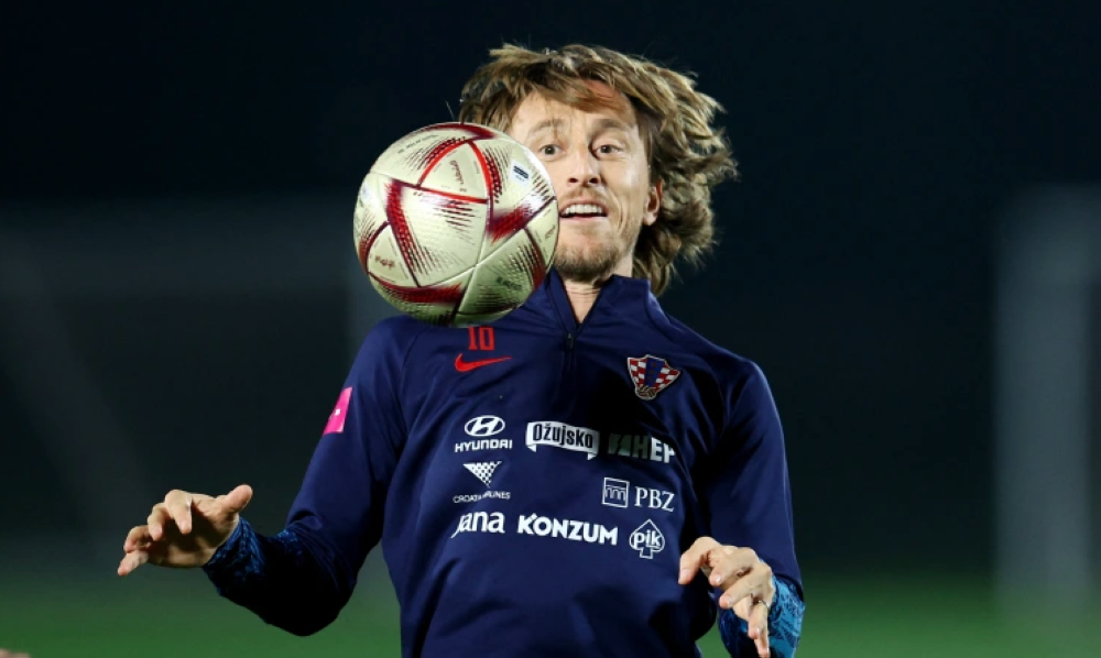 Croatia’s Luka Modric trains with the new Al Hilm ball at Al Erssal Training Site 3, Doha, Qatar, on December 11, 2022 [Molly Darlington/Reuters]