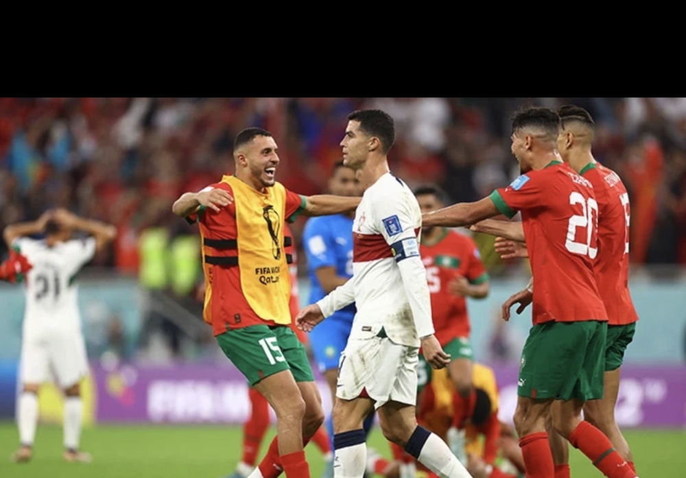 Morocco players celebrate a crucial victory over Portugal, as Cristiano Ronaldo looks so disappointed. Internet