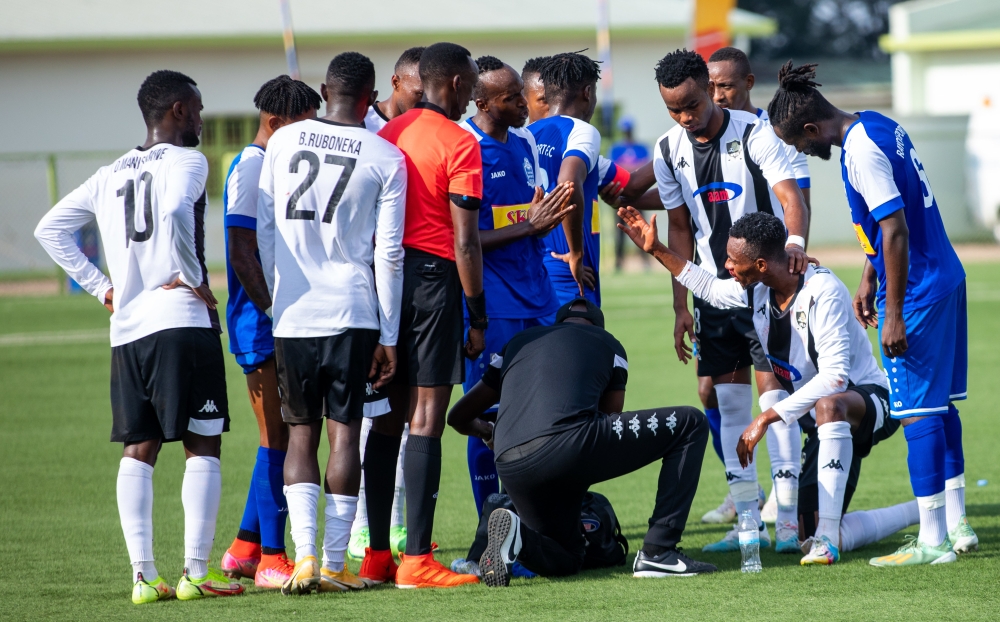 APR FC and Rayon Sports players during a past derby at Kigali stadium . Olivier Mugwiza