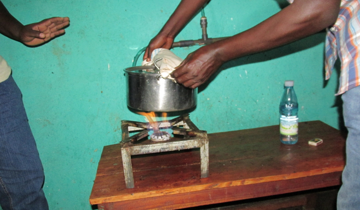 A resident cooks his meal through biogas in Huye District. The Government of Rwanda is considering the introduction of sustainable and affordable technologies to produce biogas for cooking. File