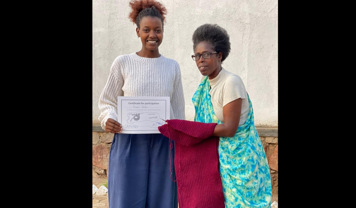 Sarah Uwase(L), posing for a picture with one of the women that particpated in a crotcheting workshop in Masaka.