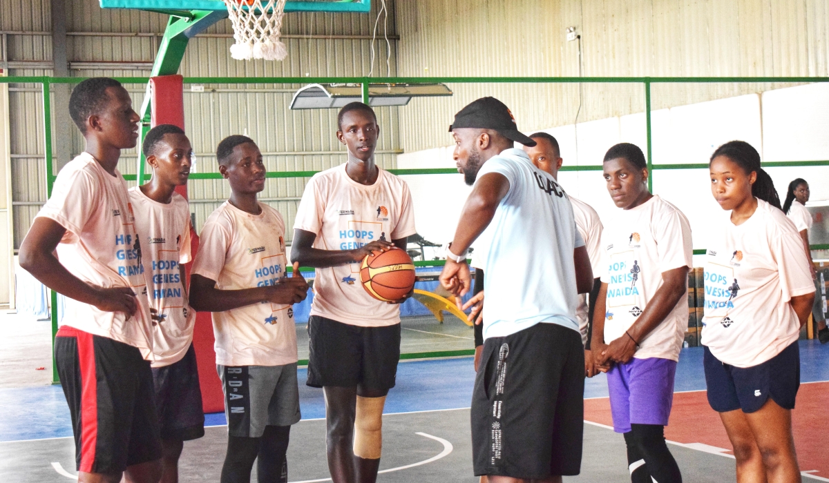 Trainees follow Innocent Kwizera, the basketball coach’s instructions during a training session on
Monday, December 19. Photo: Courtesy.