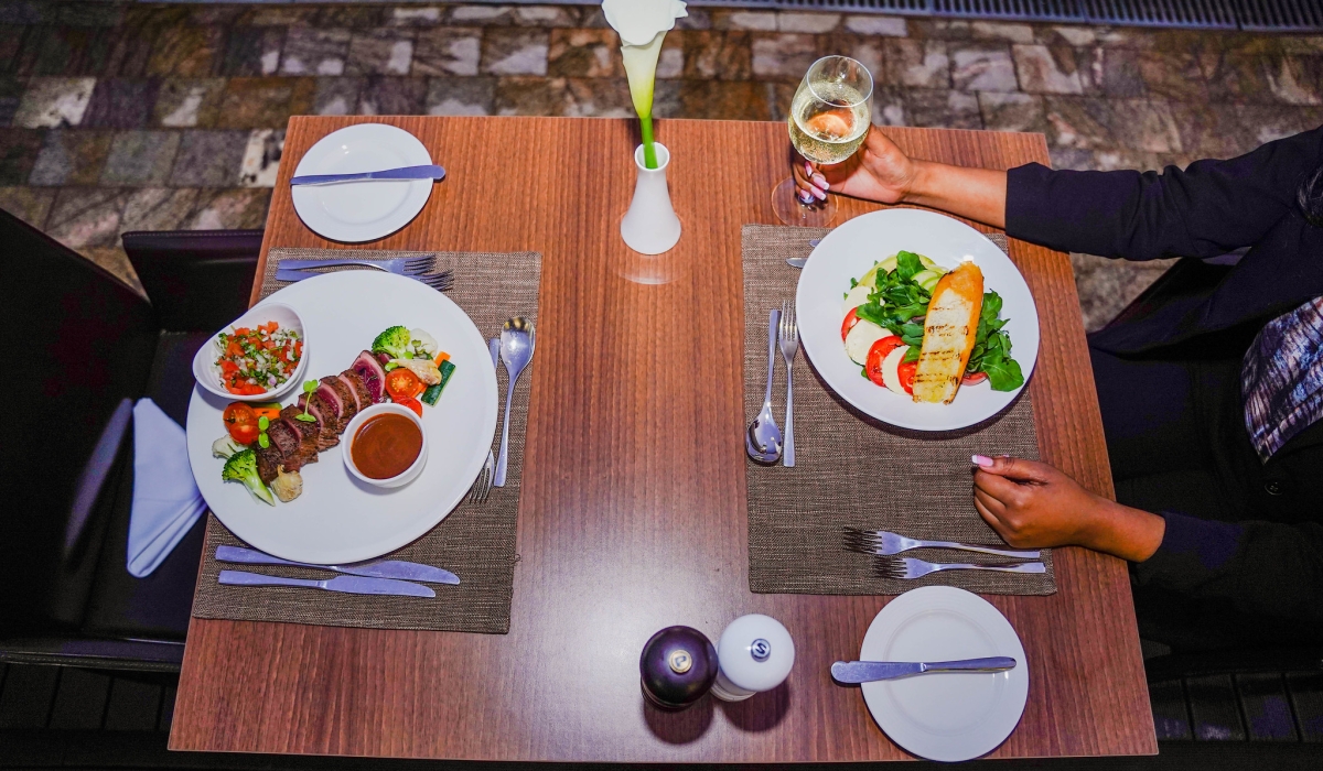 A client is served at one of the best restaurants in Kigali. When not cautious about your expenditure during the Christmas time, you are likely to meet financial  hardships as the following year begins. Dan Nsengiyumva