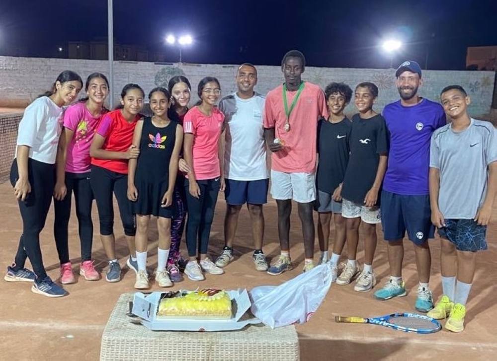 A group photo of Mugisha with former teammates in Extreme Tennis Academy in Egypt.