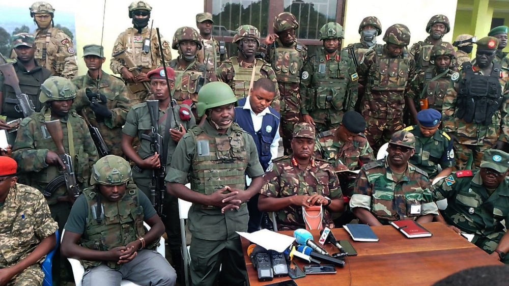 The M23 rebel group handing over Kibumba  territory to the EAC force in DRC  led by Kenyan Maj. Gen Jeff Nyagah as they withdraw from Kibumba in DR Congo. Courtesy