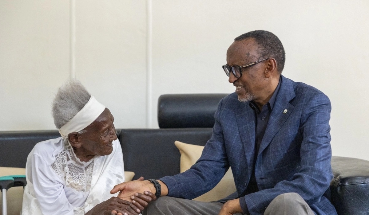 Nyiramandwa (RIP) recieving President Kagame at her home in Nyamagabe District in August. File Photo